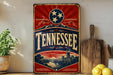 A vintage-style metal sign with the word "TENNESSEE" prominently displayed, featuring a red and blue background with a large star and a scenic illustration of a cityscape.