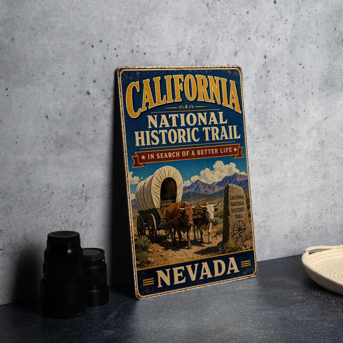 A vintage-style metal sign for the California National Historic Trail, featuring an illustration of a wagon and a wagon wheel, with the text "California National Historic Trail" and "In search of a better life" prominently displayed.