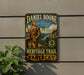 A vintage-style metal sign for the Heritage Trail in Kentucky, featuring a depiction of a man in a historical outfit and the text "Daniel Boone" and "Heritage Trail Kentucky".