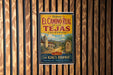 A vintage-style poster advertising the historic El Camino Real in Los Tejas, California, featuring a scenic illustration of a road leading to a church and palm trees.
