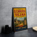A vintage-style metal sign for the historic El Camino Real in Los Tejas, California, featuring a desert landscape and a bell tower.