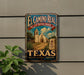 A vintage-style metal sign with the text "El Camino Real" and "The Royal Road" is displayed on a wall, featuring an illustration of a historic building and a desert landscape.
