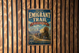 A vintage metal sign for the Historic Emigrant Trail in California, featuring an illustration of a covered wagon and mountains in the background.