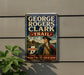 A vintage metal sign with the text "GEORGE ROGERS CLARK TRAIL INDIANA FOOTSTEPS OF HISTORY" and an illustration of a man in military attire.