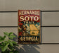 A vintage-style metal sign with the text "HERNANDO de SOTO TRAIL GEORGIA" and a map of Georgia, mounted on a wall.