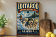A vintage-style metal sign for the Iditarod National Historic Trail in Alaska, featuring a sled dog team in a snowy landscape.