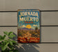 A vintage-style metal sign for the Jornada del Muerto Trail in New Mexico, featuring a desert landscape with a trail and mountains in the background.