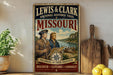 A vintage-style metal sign for the Lewis & Clark National Historic Trail in Missouri, featuring an illustration of two men in period clothing and a compass, with the text "Following in their footsteps" and "Discover + Explore + Connect".