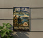 A vintage-style metal sign for the Lewis and Clark National Historic Trail in Washington, featuring a historical illustration of two men exploring the trail.