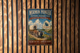A vintage-style metal sign for the Mormon Pioneer National Historic Trail, featuring an illustration of a covered wagon and a scenic landscape.