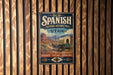 a vintage-style metal sign with a wagon and horses, mounted on a wooden wall.