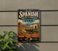 a vintage-style metal sign with a wagon and mountains in the background, mounted on a wall.