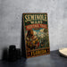 a vintage metal sign with the text "SEMINOLLE WARS HERITAGE TRAIL FLORIDA" and an illustration of a Native American man holding a rifle.