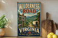 A vintage-style metal sign for the Wilderness Road in Virginia, featuring a wagon train and a scenic mountain landscape.