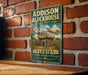 A vintage-style sign for Addison Blockhouse Historic State Park in Florida, featuring a wooden fort or tower with a flag and palm trees.