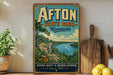 a vintage-style sign for Afton State Park in Minnesota, with a scenic landscape depicting a lake, mountains, and a sailboat.