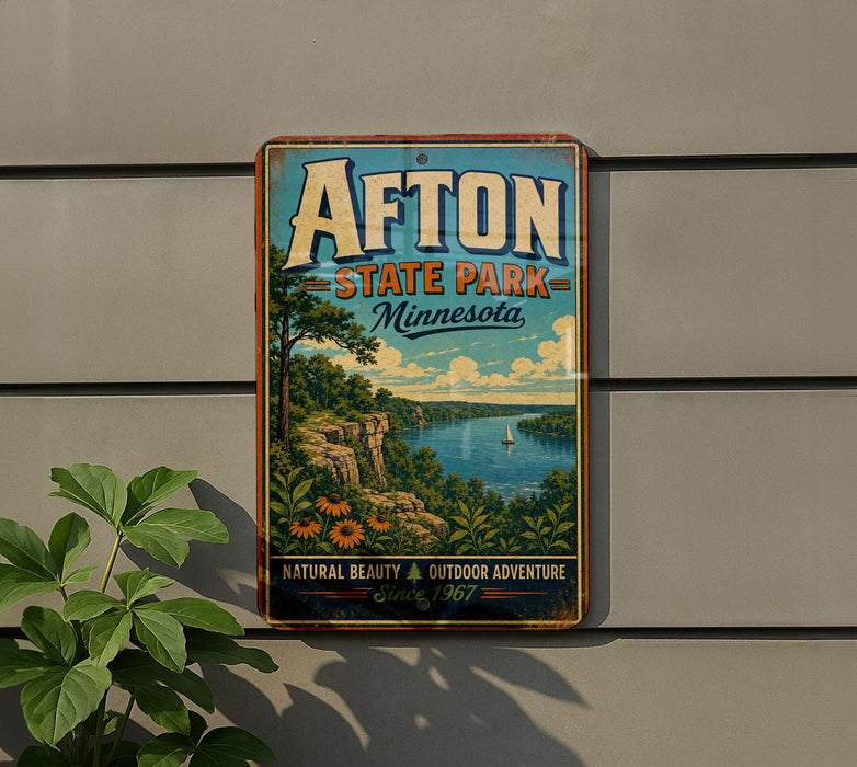 A vintage-style metal sign for Afton State Park in Minnesota, featuring a scenic landscape with a river, mountains, and a boat.