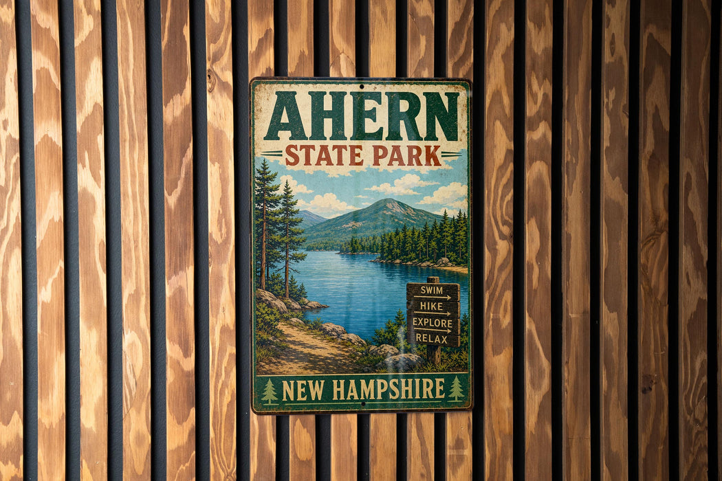 A vintage metal sign for Ahern State Park in New Hampshire, featuring a scenic landscape with a lake, mountains, and pine trees.