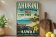 A vintage-style metal sign for the Ahukini Recreation Area in Hawaii, featuring a tropical beach scene with a turtle, palm trees, and a hibiscus flower.