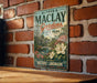 A vintage-style metal sign for Alfred B. Maclay Gardens, a historic landmark in Tallahassee, Florida.