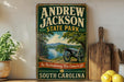 A vintage-style sign for Andrew Jackson State Park in South Carolina, featuring a cannon and a scenic landscape.
