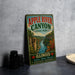 A vintage-style metal sign for Apple River Canyon State Park in Illinois, featuring a scenic illustration of the canyon and its surroundings.