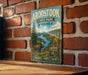 A vintage metal sign for Aroostook State Park in Maine, featuring a moose and a sign that says "The Crown of Maine".
