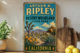 A vintage-style sign for Arthur B Ripley Desert Woodland State Park in California, featuring a desert landscape with a path leading through the scene.