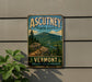 A vintage-style metal sign for Ascutney State Park in Vermont, featuring a scenic mountain landscape with pine trees and a winding path.