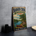 A vintage-style metal sign for Badger Creek State Recreation Area in Iowa, featuring a scenic illustration of a lake, canoe, and trees.