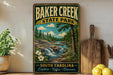 A vintage-style sign for Baker Creek State Park, featuring a scenic illustration of a river and forest landscape.