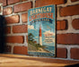 A vintage-style sign for BarnEGAT LIGHTHOUSE STATE PARK in New Jersey, featuring a lighthouse and a coastal landscape.