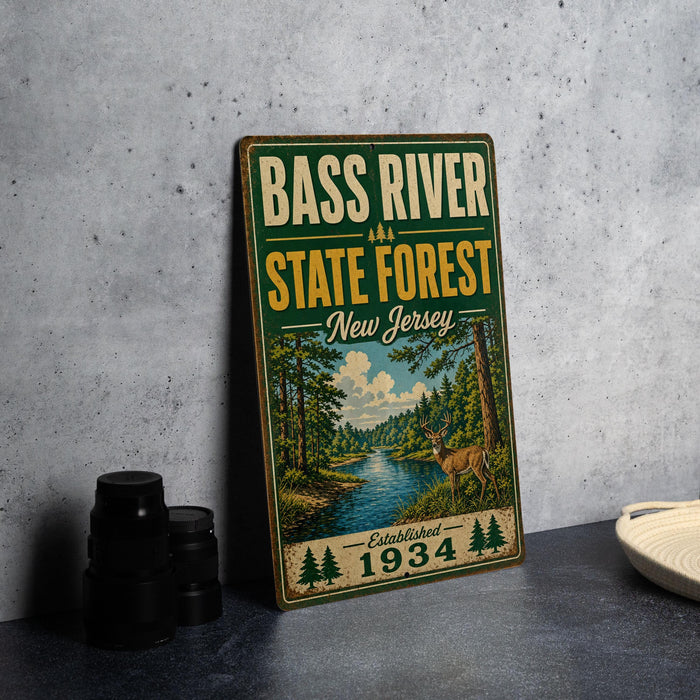 A vintage-style metal sign for the Bass River State Forest in New Jersey, featuring a scenic illustration of a forest and a river.