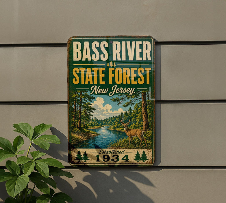 A vintage-style metal sign for the Bass River State Forest in New Jersey, featuring a scenic illustration of a forest and a deer.