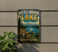 A vintage-style metal sign for Battle Ground Lake State Park in Washington, featuring a scenic image of the lake and mountains.