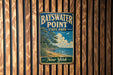 A vintage metal sign for Bayswater Point State Park in New York, featuring a scenic landscape with a beach, trees, and a body of water.