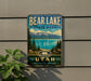 A vintage metal sign for Bear Lake State Park in Utah, featuring a scenic landscape with mountains, pine trees, and a lake.