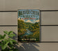 A vintage-style sign for Beaver Creek Valley State Park in Minnesota, featuring a scenic landscape with a river and trees.