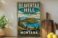 A vintage-style metal sign for Beavertail Hill State Park in Montana, featuring a scenic landscape with mountains, pine trees, and a lake.