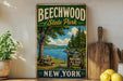 A vintage-style sign for Beechwood State Park in New York, featuring a scenic image of a lake and forest.
