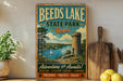 A vintage-style metal sign for Beeds Lake State Park in Iowa, featuring a scenic image of the lake and surrounding landscape.