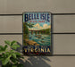 A vintage-style metal sign for Belle Isle State Park in Virginia, featuring a scenic illustration of a bridge over a river surrounded by lush greenery.