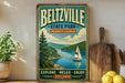 A vintage-style metal sign for Beltzville State Park in Pennsylvania, featuring a scenic illustration of a lake with a sailboat, surrounded by mountains and trees.