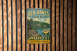 A vintage-style metal sign for Ben Hawes State Park in Kentucky, featuring a scenic landscape with a lake and mountains.