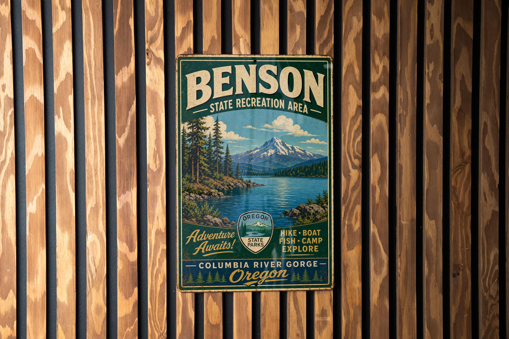 A vintage metal sign for the Oregon State Recreation Area, featuring a scenic mountain landscape with a lake and forest.