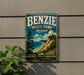 A vintage-style metal sign for Benzie State Park, Michigan, featuring a scenic landscape with a beach, mountains, and pine trees.