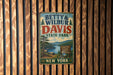 A vintage metal sign for Betty & Wilbur Davis State Park in New York, featuring a scenic landscape with a lake and mountains.