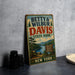 A vintage metal sign for Betty & Wilbur Davis State Park in New York, featuring a scenic illustration of the park and its surroundings.
