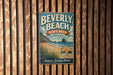 A vintage-style metal sign for Beverly Beach State Park in Oregon, featuring a beach scene and the text "Discover the Oregon Coast".