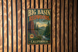 A vintage-style metal sign for Big Basin Redwoods State Park in California, featuring a scenic image of the park's landscape.